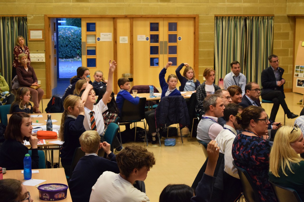 Students with their hands up